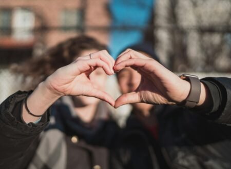 two person combine hand forming a heart hand gesture